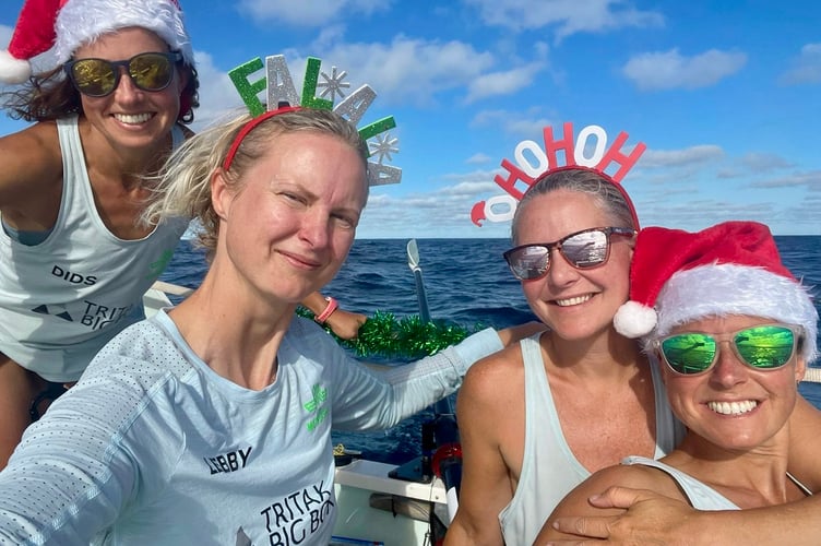 Felicity, left, with Lebby, Jo and her sister Pip celebrate Christmas Day 2021 in the middle of the Atlantic Ocean