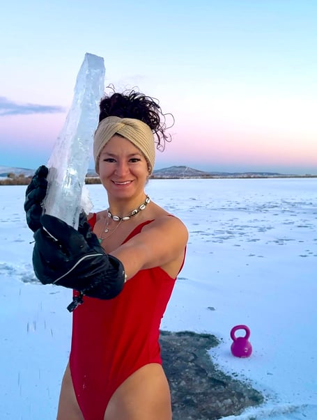 Zoe Naughalty thinks nothing of smashing the ice for a chilly dip