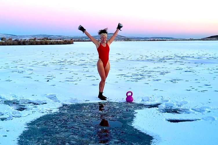 Snow holding back Zoe Naughatly from a wold swim, whatever the temperature!