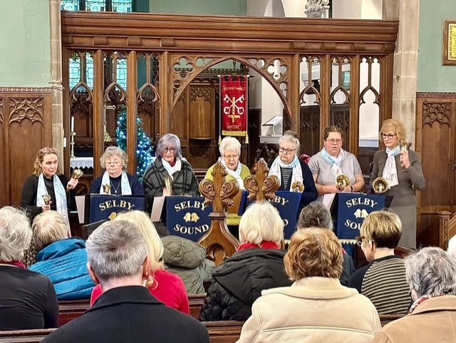 Members try their hand at handbells