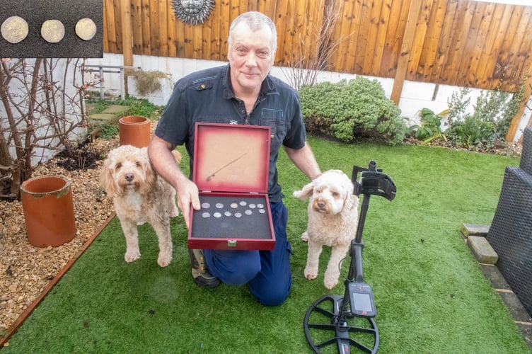 Rob Moore with the coins and cockapoos Stan and Fifa. Inset: A close-up of some of the coins.