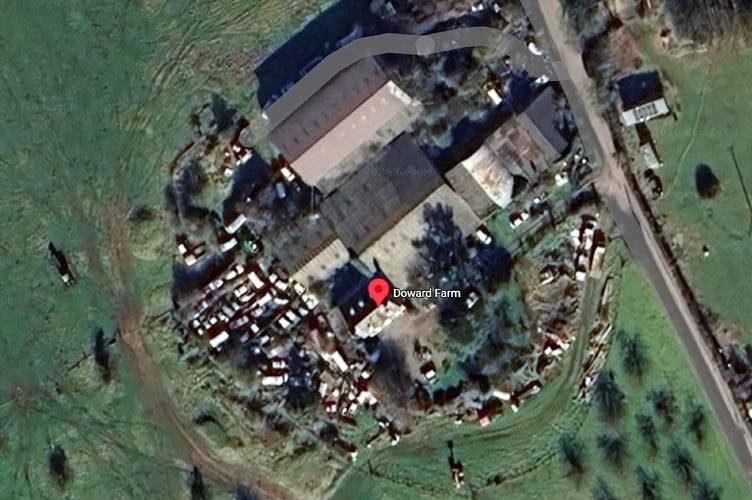 An aerial view of Doward farm showing cars parked there