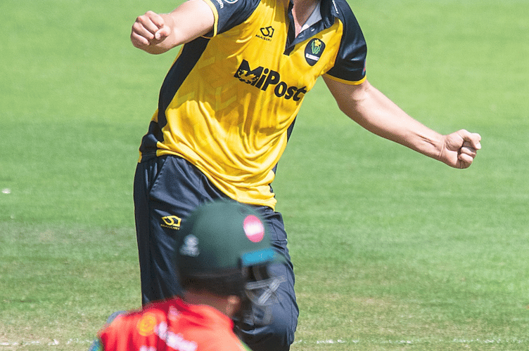 Tom Norton wheels away in triumph after trapping the Pakistan skipper lbw