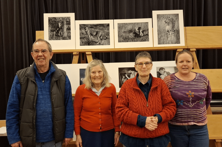 Monmouth winners of The Gwyn Morgan Trophy for a set of four monochrome prints. The photographers are Terry Wall, Sue Carter, Wendy Conway and Elisa Best and their winning photographs are behind them. 