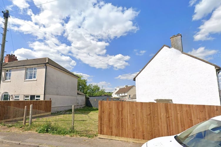 This large timber fence, beside the house, was criticised by a councillor at a meeting which approved a plan to build a two bedroom home on the patch of grass behind
