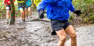Spirit runners splash through puddles and mud