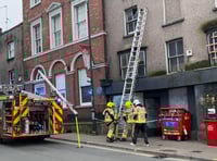 Fire service removes dangerous glass pane from Monmouth high street