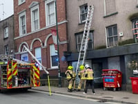 Fire service removes dangerous glass pane from Monmouth high street