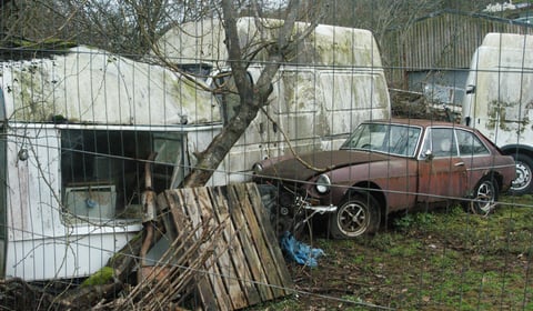 Council considers next move over 'blot on landscape' car collection