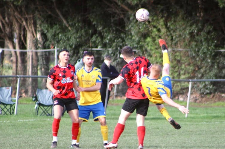 A Monmouth player tries a high-flying overhead kick