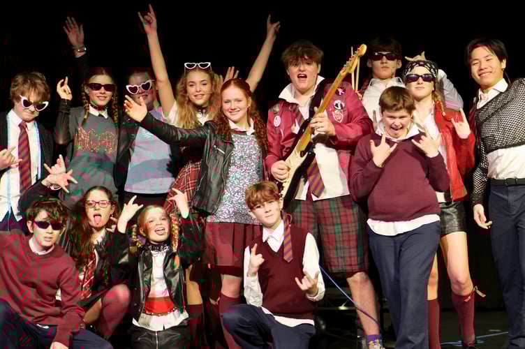 Cast of the School of Rock by Haberdashers' Monmouth School