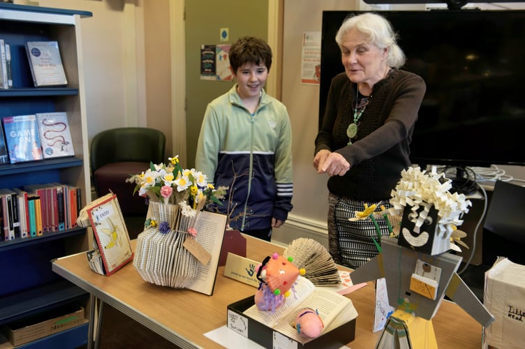 Helen Wragg and Ollie Morgan admire some of the entries from primary pupils