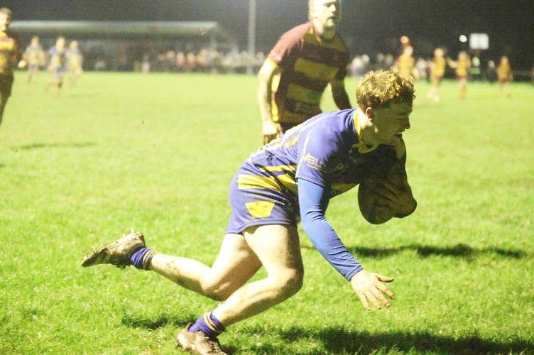 Will Dudman races away for the first of his two tries