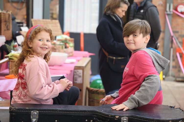 Young supporters helpng with the raffle