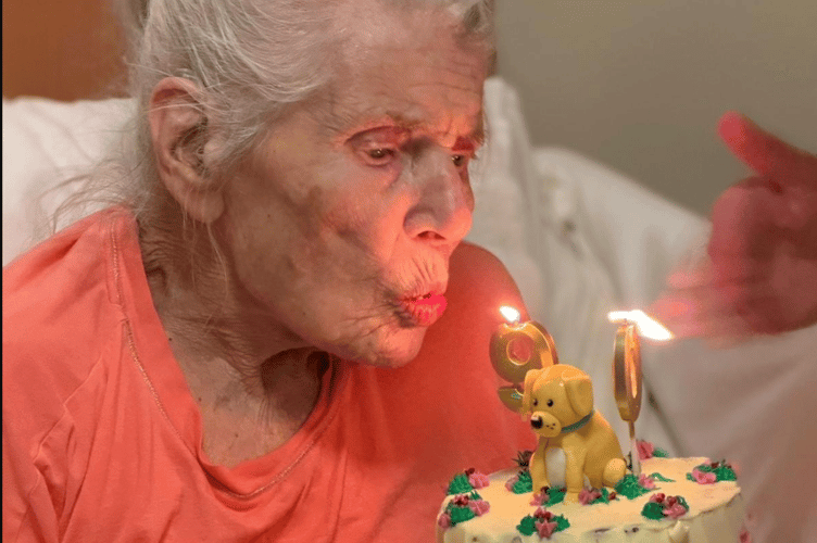 Jingy and her birthday cake at Gibraltar Nursing Home 