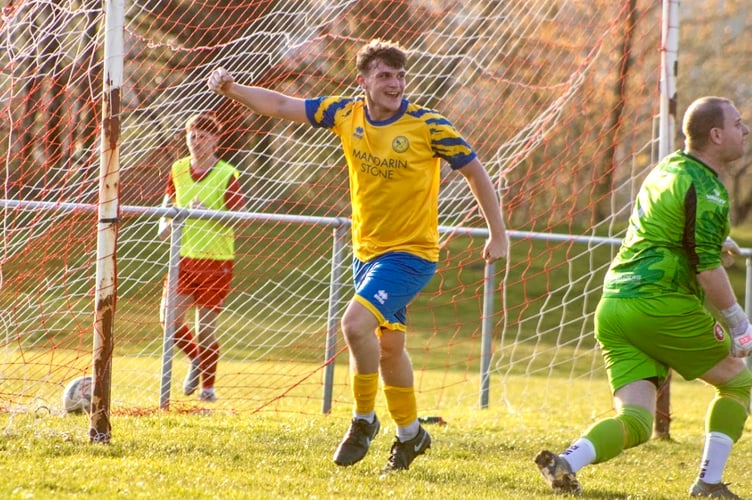 Jake Lewis celebrates the opening goal for Monmouth Town at Cefn Fforest