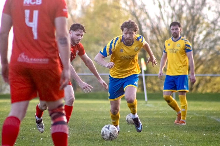 Robbie Atkinson drives at the Cefn defence
