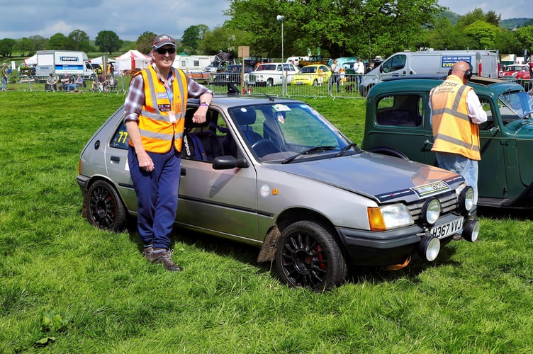 Alex Simmons with the Peugeot 206 he bought back after his cancer was clear