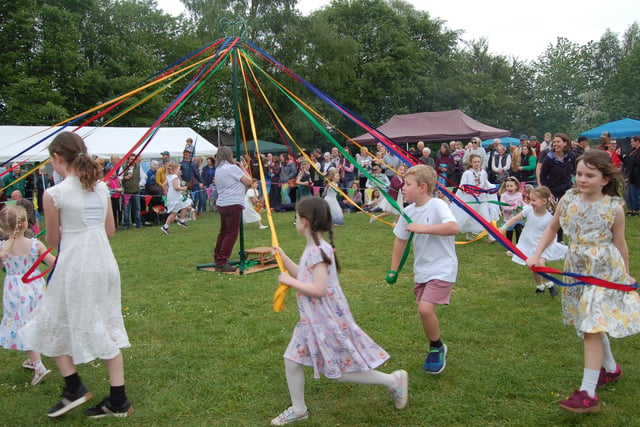 Llangrove villagers celebrate May Day with traditional maypole dance