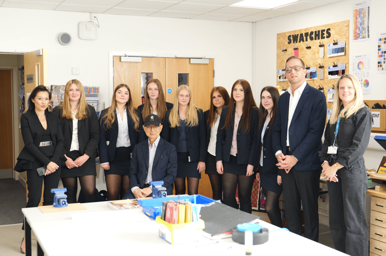 Professor Jimmy Choo with students from Haberdashers' Monmouth School. 