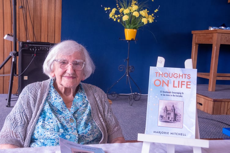 Marjorie Mitchell with her new book.