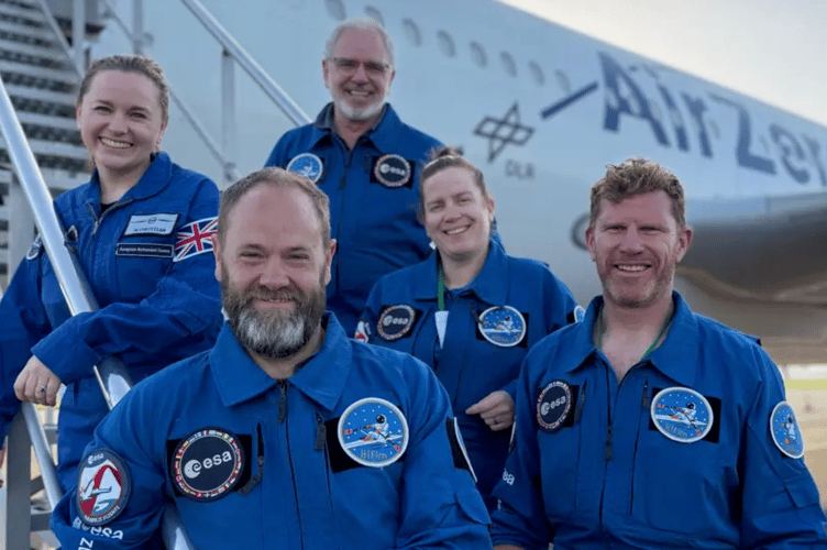 Matt Wells, right, with Space rowing machine designer John Kennett and the rest of the crew who took part in the European Space Agency zero gravity test flights