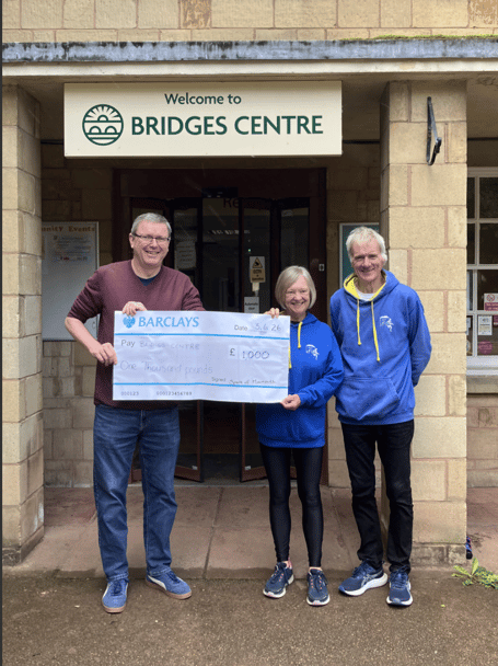 Alison and Steve McMenemy from Spirit of Monmouth Running Club present a £1,000 donation to Ben Ford of Bridges Centre following this year's Kymin Dash.