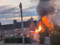 Man held over suspected arson after caravan blaze 