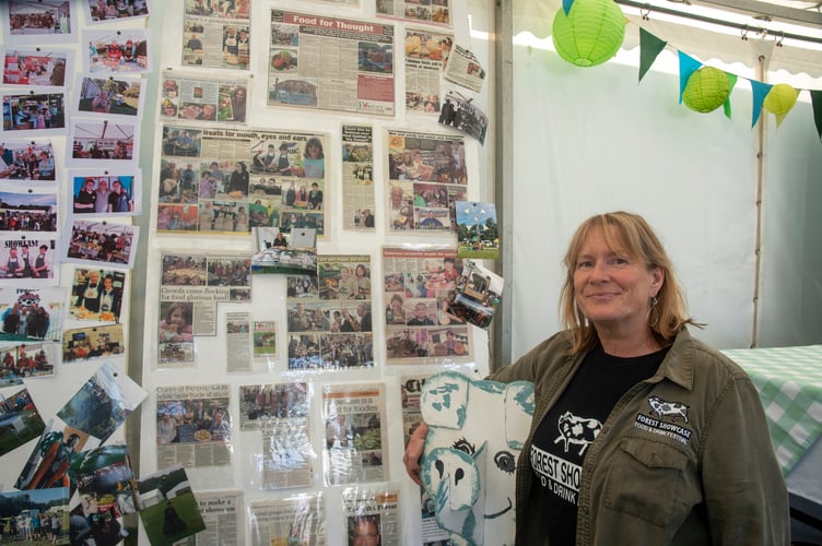 Rachel Smith with from the Showcase team with a display marking 25 years of the event